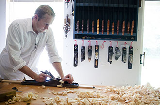 Joshua Farnsworth Handplaning A Board On A Sjobergs Workbench