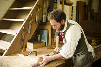 Bill Pavlack Handplaning On A Woodworking Bench Which Is An Antique Wooden Workbench