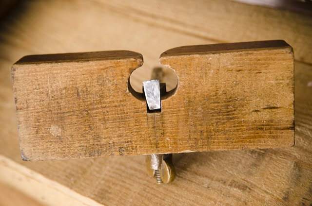 Wood Plane: Bottom View Of An Antique Wood Router Plane Called An Old Woman'S Tooth Router With Cutting Iron