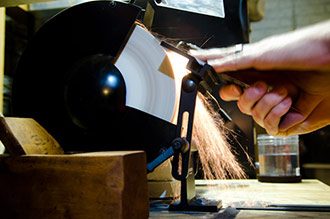 Hand Plane Sharpening On A Slow Speed Grinder With Aluminum Oxide Wheel Making Sparks