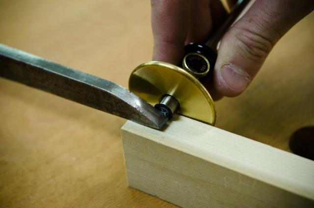 Using A Wheel Marking Gauge To Mark A Mortise Next To A Mortise Chisel On A Mortise And Tenon Joint