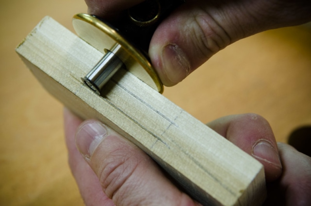 Using A Wheel Marking Gauge To Scribe A Line On A Mortise On A Mortise And Tenon Joint