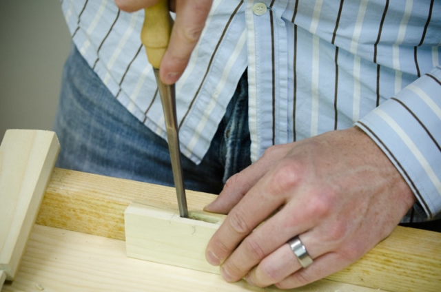Using A Bench Chisel To Clean A Mortise