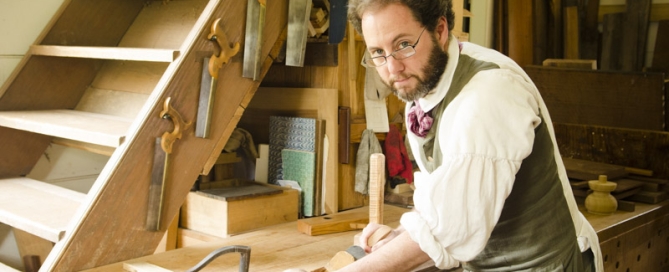 Woodworker Bill Pavlak Using A Wood Plane Hand Plane On A Wood Work Bench In A Historical Wood Shop