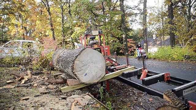 Loading A Log Onto A Portable Bandsaw Mill
