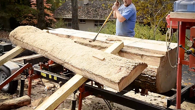 Sliding A Slab From A White Oak Log On A Portable Bandsaw Mill
