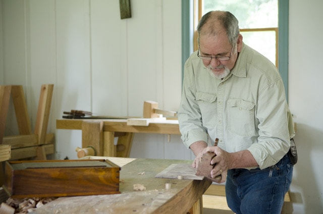 David Ray Pine Using A Moving Fillister Rabbet Plane Woodworking Hand Tool On A Moravian Workbench In A Wood Shop