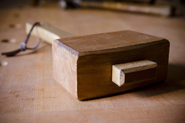Wooden Joiner's Mallet Or Carpenter's Mallet On Workbench