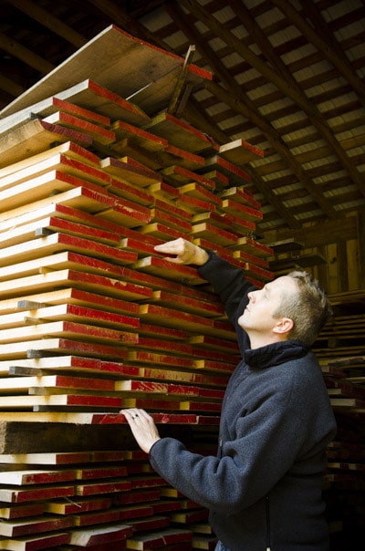 Joshua Farnsworth Choosing Wood Lumber At A Saw Mill Lumber Yard For Woodworking