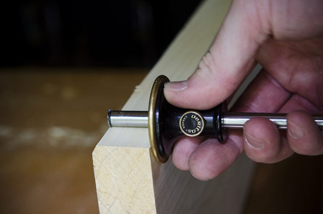Checking Board Thickness With Wheel Marking Gauge To Flatten Board By Hand Planing