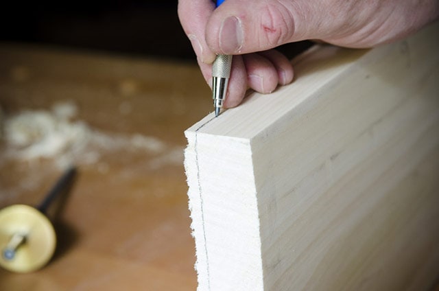 Using A Pencil To Mark Board Thickness To Flatten Board By Hand Planing