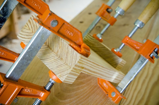 Gluing Up A Southern Yellow Pine Bench Hook With Orange Bar Clamps On A Woodworking Workbench