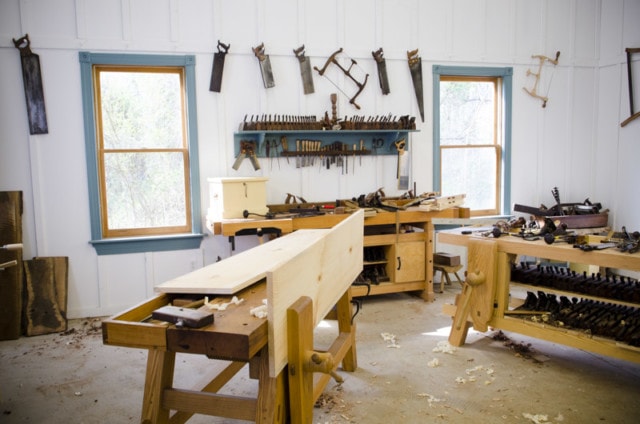 A Lumber Panel Sitting In A Woodworking Workbench Leg Vise During A Trestle Table Build In Joshua Farnsworth'S Woodworking Workshop