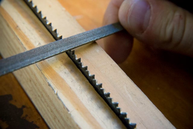 Using a hand saw file for saw sharpening