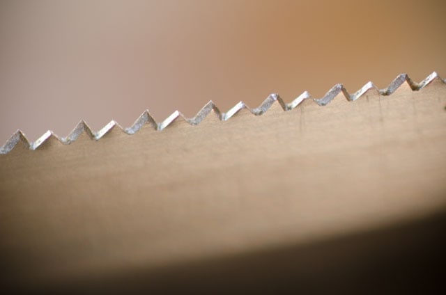 Close-Up View Of Cross Cut Hand Saw Teeth During Hand Saw Sharpening