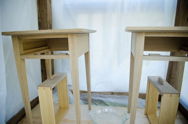 Ammonia fuming quartersawn white oak end tables and drawers in a plastic tent