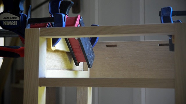 Using Wood Clamps To Glue Drawer Spacers To Build A Table