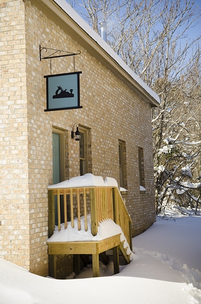 Snowy Exterior Of Wood And Shop Traditional Woodworking School