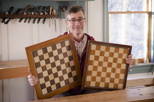 Dave Heller Holding Two Veneered And Inlaid Chess Boards