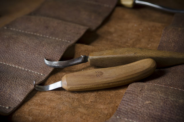 Green Woodworking Hook Knives On A Leather Tool Roll