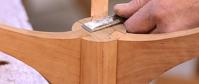Hand Using A Chisel To Cut A Sliding Dovetail Joint On A Candle Stand Spindle By Will Myers