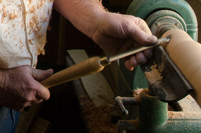 Wood Turner Using Wood Turning Tools Skew Chisel On A Wood Lathe