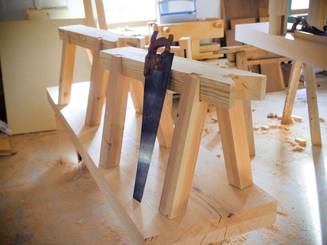Timber Framing Sawbench Pair With A Woodworking Hand Saw