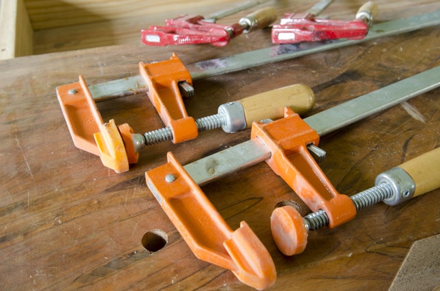 F Style Woodworking Clamps On A Woodworking Workbench