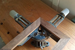 A Picture Frame Clamp Holds A Miter Joint Together 
