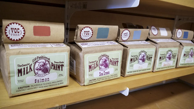 Bags Of Old-Fashioned Milk Paint Sitting On A Shelf In A Woodworking Store