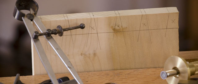 Dovetail Tail Board With Dividers, Combination Square, Marking Gauge, And Pencil In The Foreground