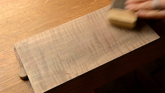 Sanding The Dark Walnut Aniline Dye Coloring Off Of A Curly Maple Board 