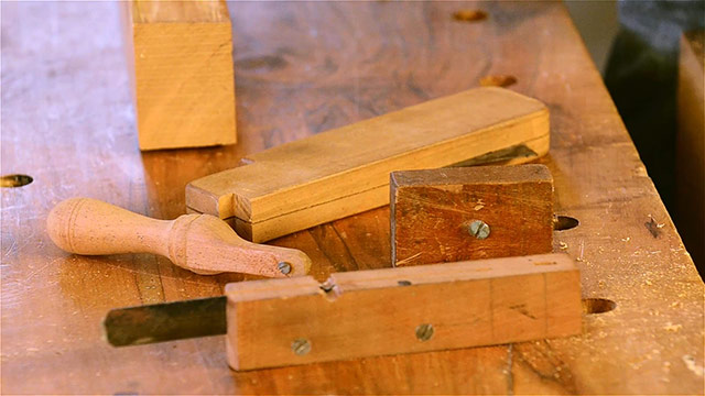 David Ray Pine Displaying Multiple Scratch Stocks On A Woodworking Workbench