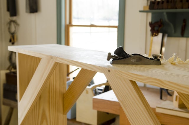 Shaker Bench Sitting On A Workbench With A Stanley Block Plane For Woodworking Plans