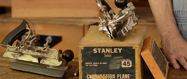 Stanley 45 Combination Plane Box With Three Combination Planes Or Universal Planes On A Woodworking Workbench