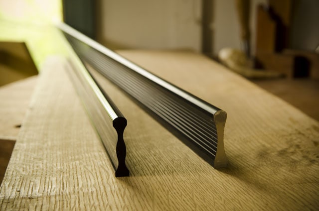 Metal Straight Edges Sitting On A Roubo Woodworking Workbench