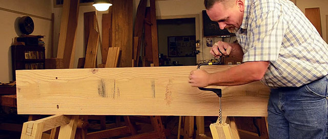 Will Myers Using A Brace And Bit To Bore A Hole In A Moravian Workbench For Blind Pegging The Top To The Undercarriage