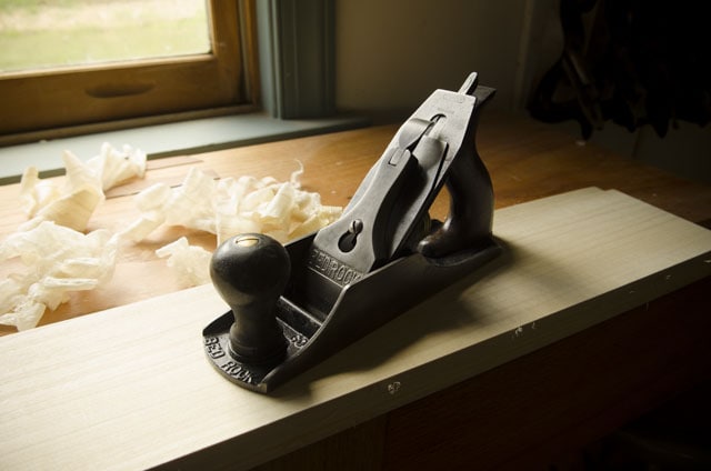 Stanley Bed Rock 604 Smoothing Plane With Shavings And Board Sitting On A Roubo Workbench