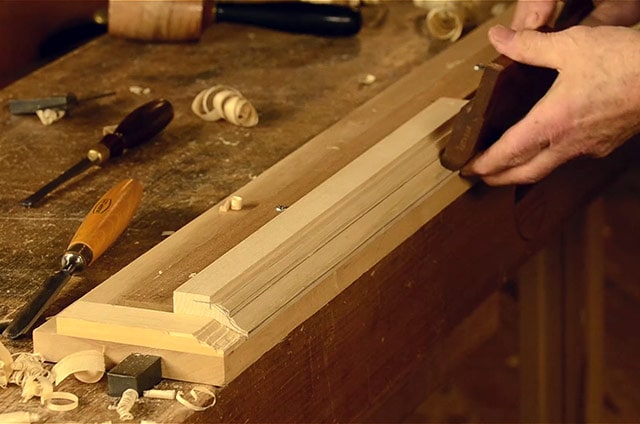 Woodworker Using A Sticking Board To Hold Wood For Using Hollows And Rounds Molding Planes