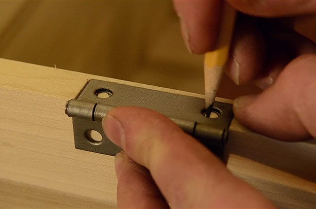 Outlining Holes With A Pencil While Installing Butt Hinges On A Dovetail Chest