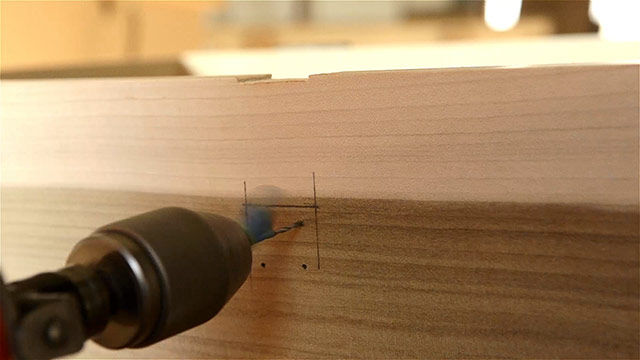 Woodworker Using A Egg Beater Drill To Bore Screw Holes Into Historical Hasp Hardware Installed On A Dovetail Chest