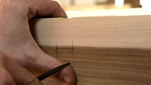 Woodworker Using An Awl To Start A Hole Before Boring Screw Holes Into Historical Hasp Hardware Installed On A Dovetail Chest