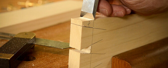 Cutting Dovetails With Woodworking Hand Tools Woodworker Using A Chisel To Trim A Dovetail Joint