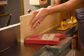 Joshua Farnsworth Jointing The Edge Of A Board On A Grizzly Power Jointer