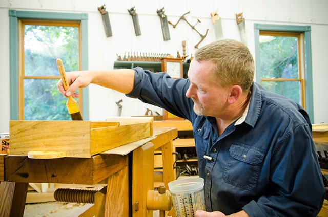 Will Myers Applying Shellac With A Brush While Making The Isaac Youngs Shaker Wall Clock 