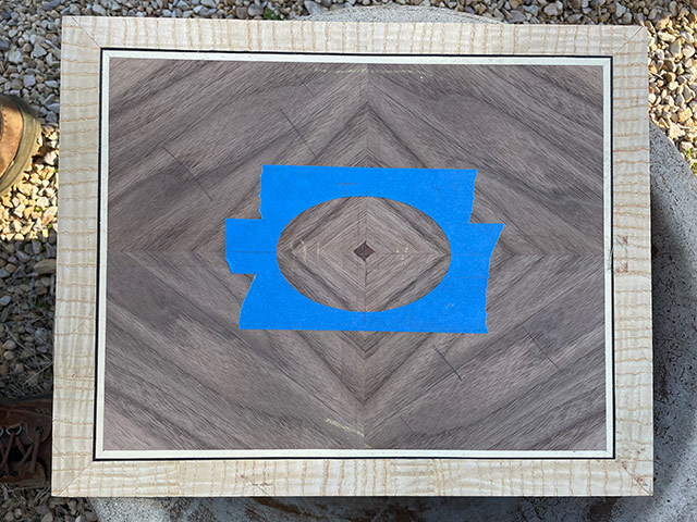 Wood Veneering Panel For Woodworking With Blue Tape For Routing The Oval
