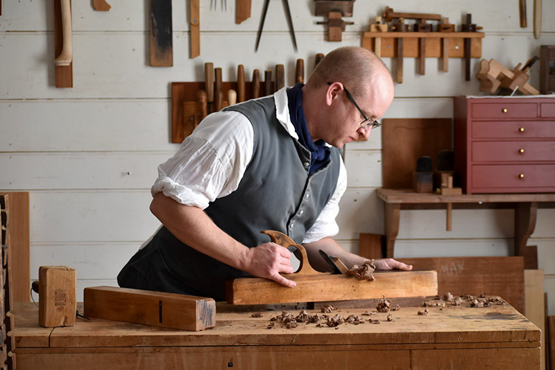 Jeremy Tritchler Using A Hand Plane In The Hay'S Cabinetmaking Shop At Colonial Williamsburg