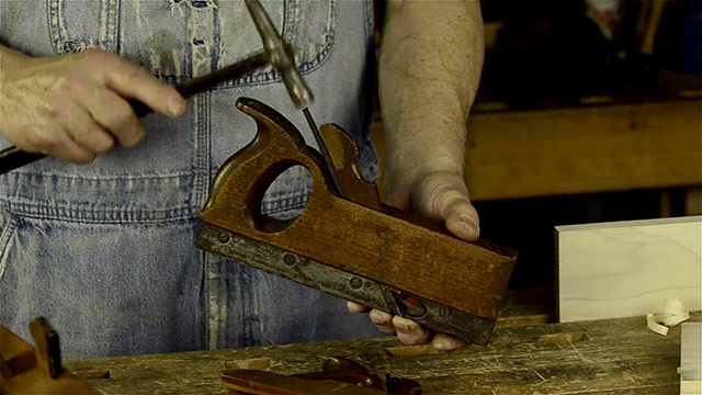 Adjusting A Wood Tongue And Groove Plane With A Hammer
